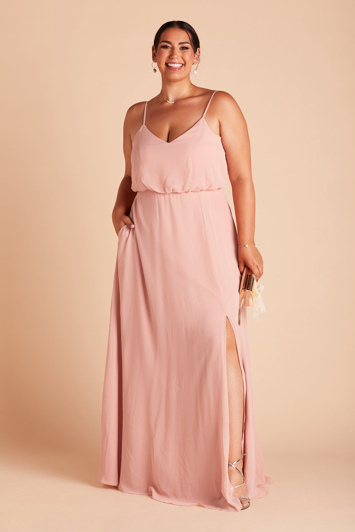 Gwennie plus size bridesmaid dress with slit in dusty rose chiffon by Birdy Grey, front view with hand in pocket