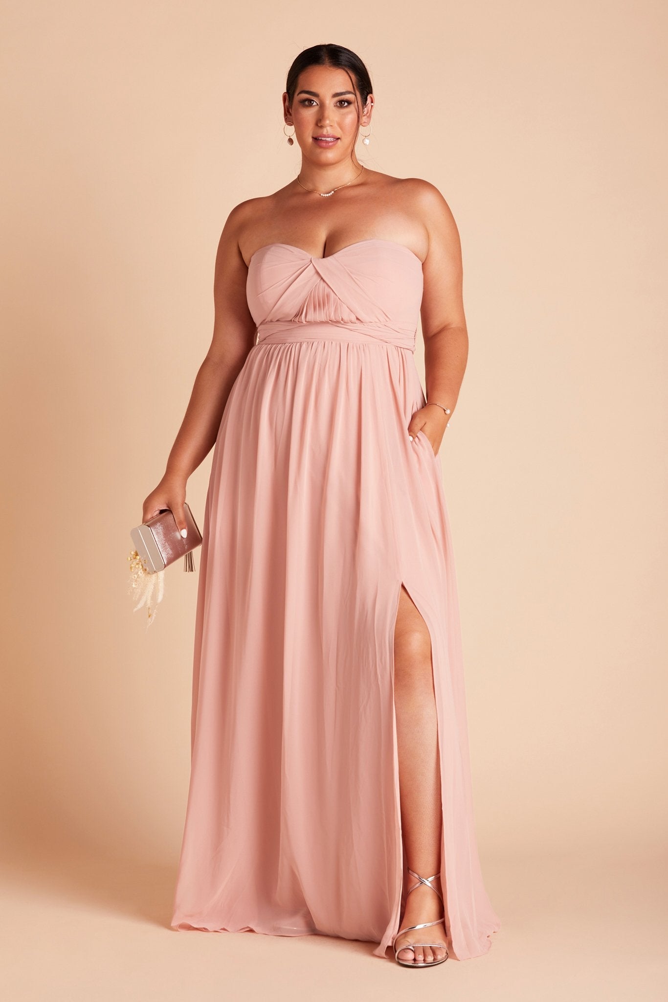 Grace convertible plus size bridesmaid dress in rose quartz pink chiffon by Birdy Grey, front view with hand in pocket