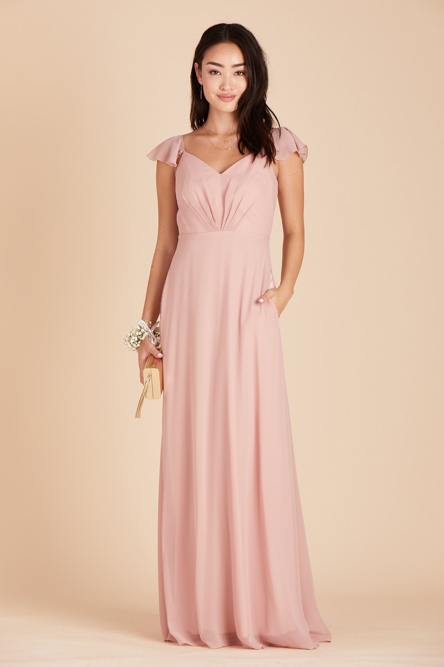 Kae bridesmaids dress in dusty rose pink chiffon by Birdy Grey, front view with hand in pocket