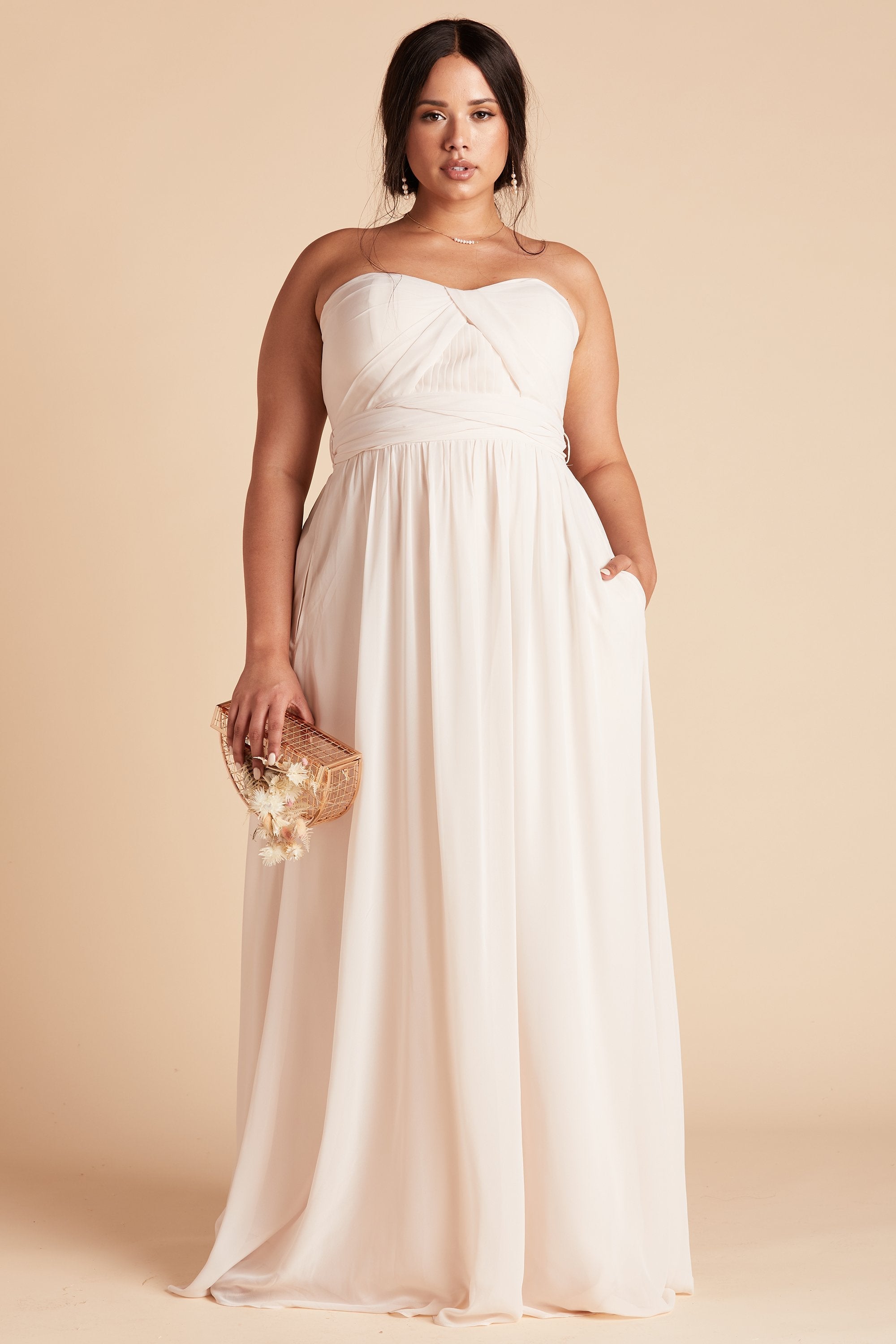 Grace convertible plus size bridesmaid dress in champaign chiffon by Birdy Grey, front view with hand in pocket