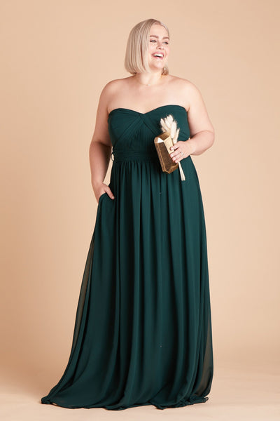 Front view of the floor-length Grace Convertible Plus Size Bridesmaid Dress in emerald chiffon by Birdy Grey features a sweetheart neckline and hidden pockets.