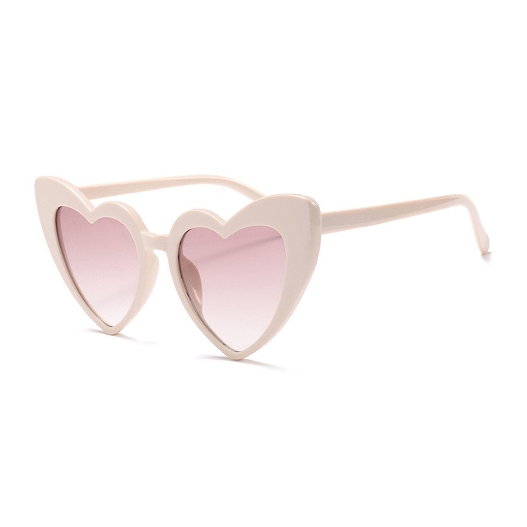 Side view of Heart Sunglasses in nude by Birdy Grey features a plastic frame and a rosy lens.