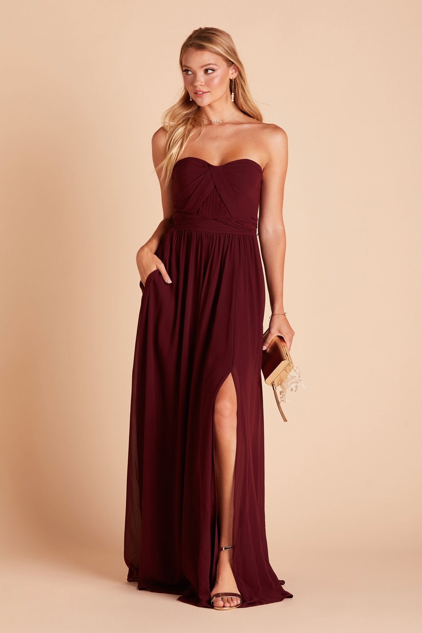 Grace convertible bridesmaid dress with slit in cabernet burgundy chiffon by Birdy Grey, front view with hand in pocket