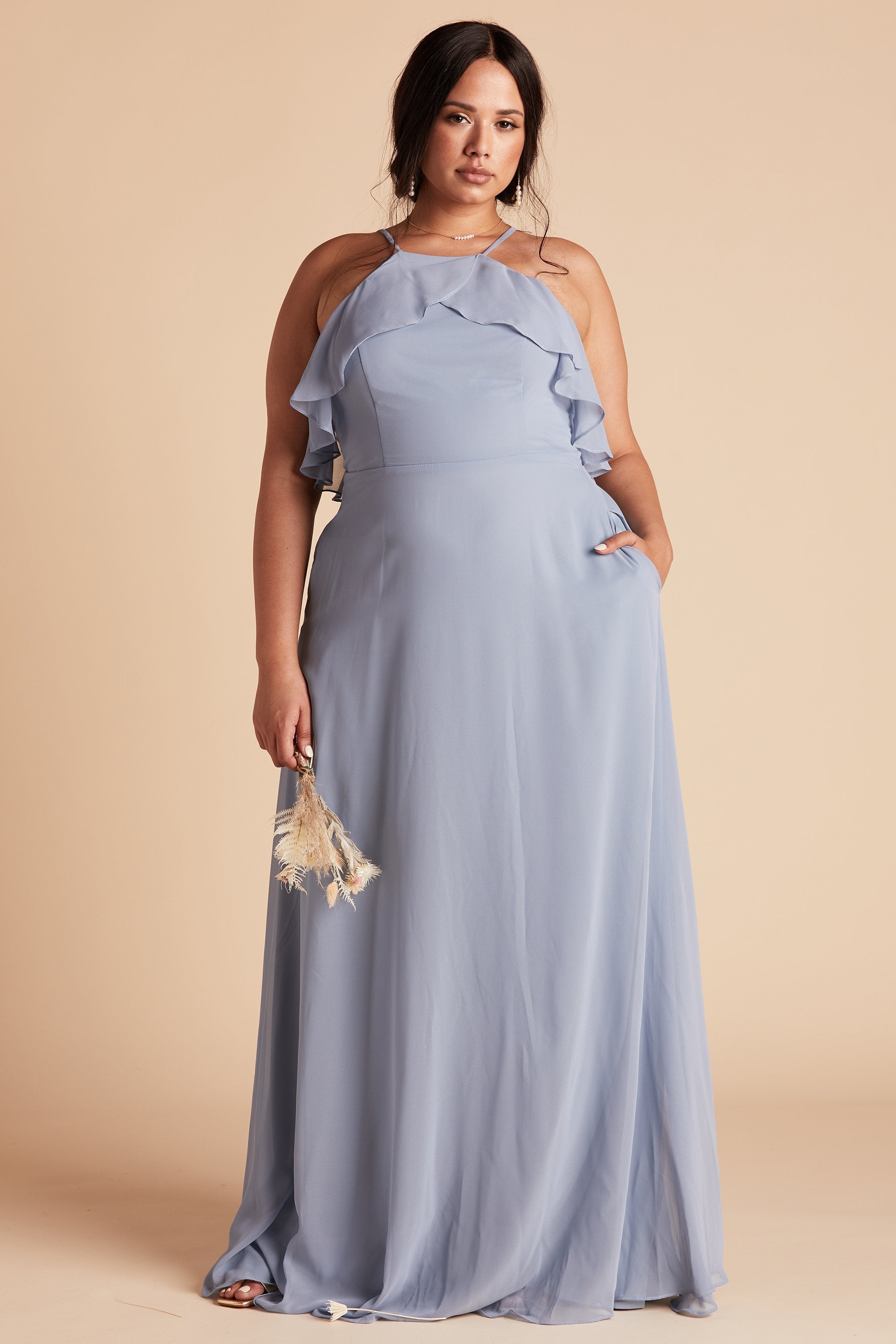 Jules plus size bridesmaid dress in dusty blue chiffon by Birdy Grey, front view with hand in pocket