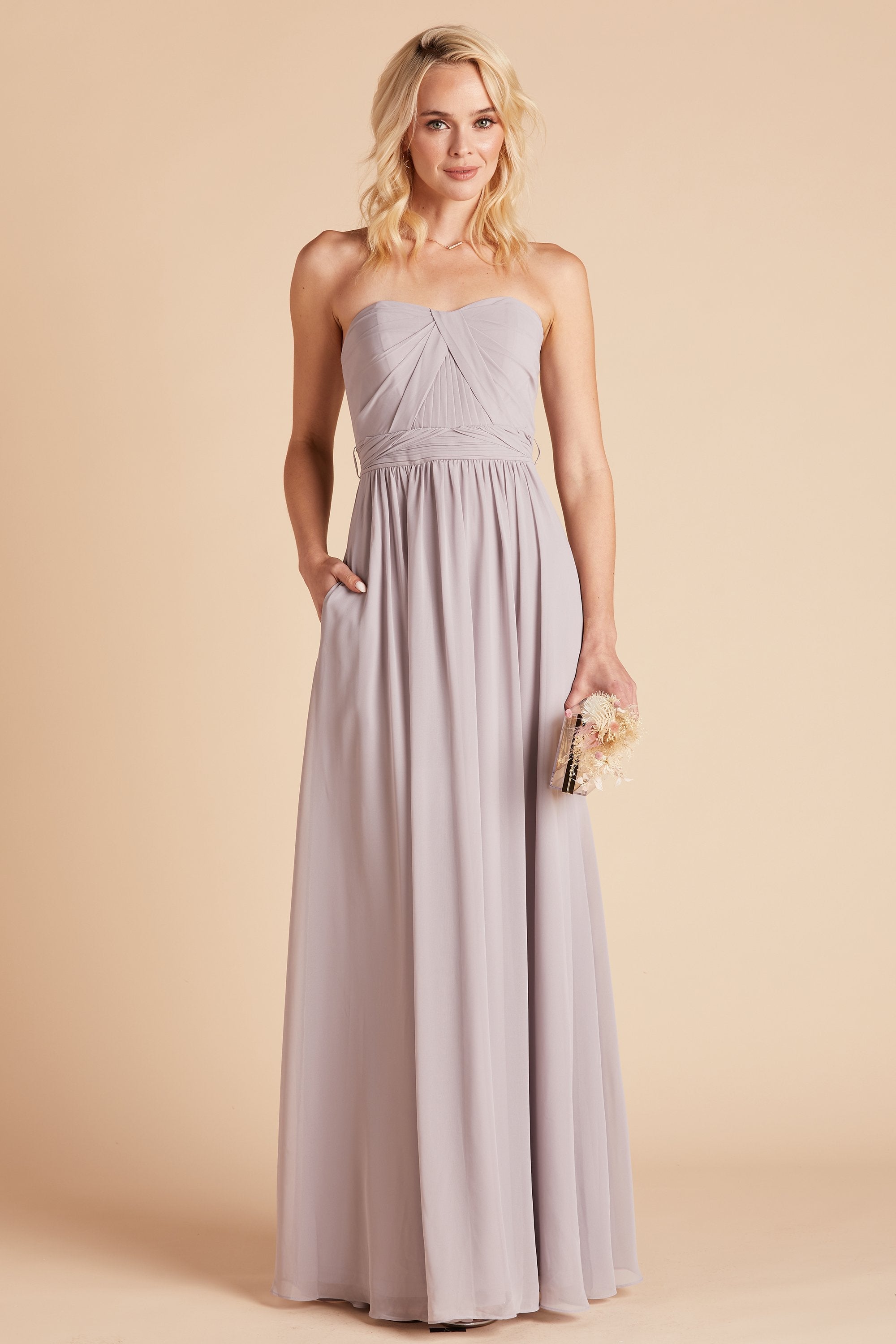 Grace convertible bridesmaid dress in lilac purple chiffon by Birdy Grey, front view with hand in pocket