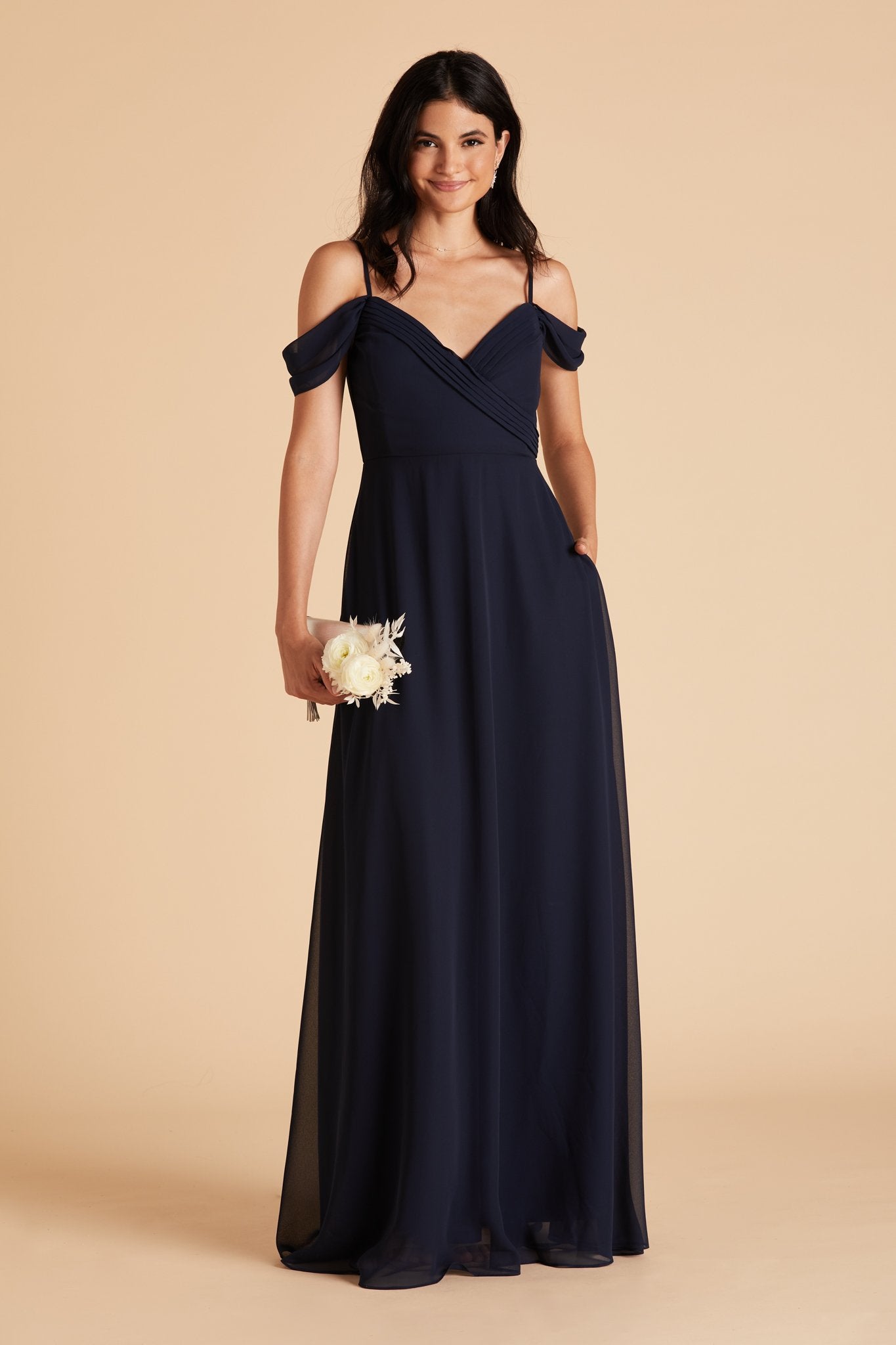 Spence convertible bridesmaid dress in navy blue chiffon by Birdy Grey, front view with hand in pocket