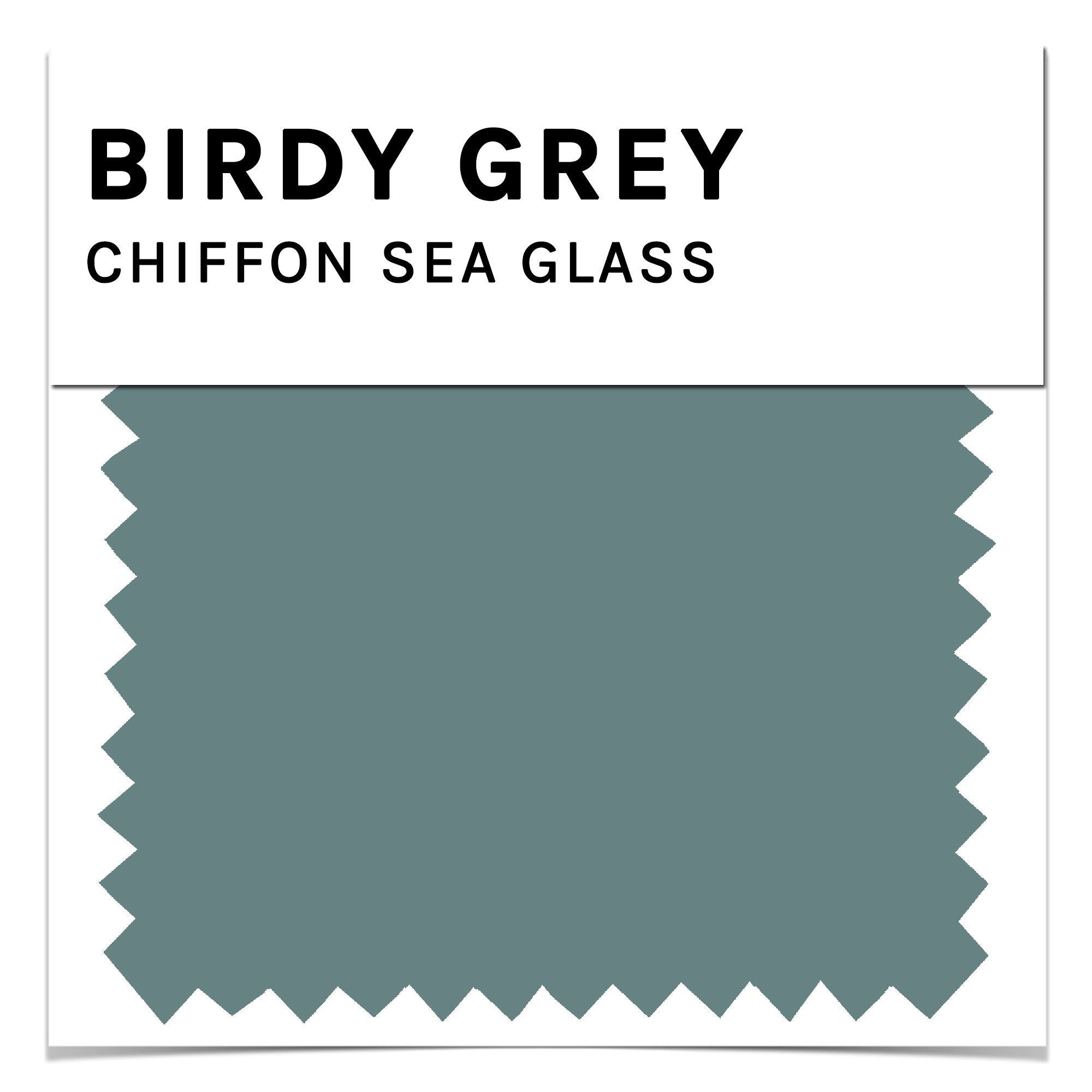 Front closeup view of the Birdy Grey color swatch card for chiffon fabric in sea glass. The sea glass color is a medium green blue color.