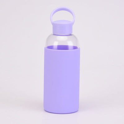 Reusable Glass Water Bottle with a purple cap and purple silicone sleeve drinkware by Birdy Grey, front view