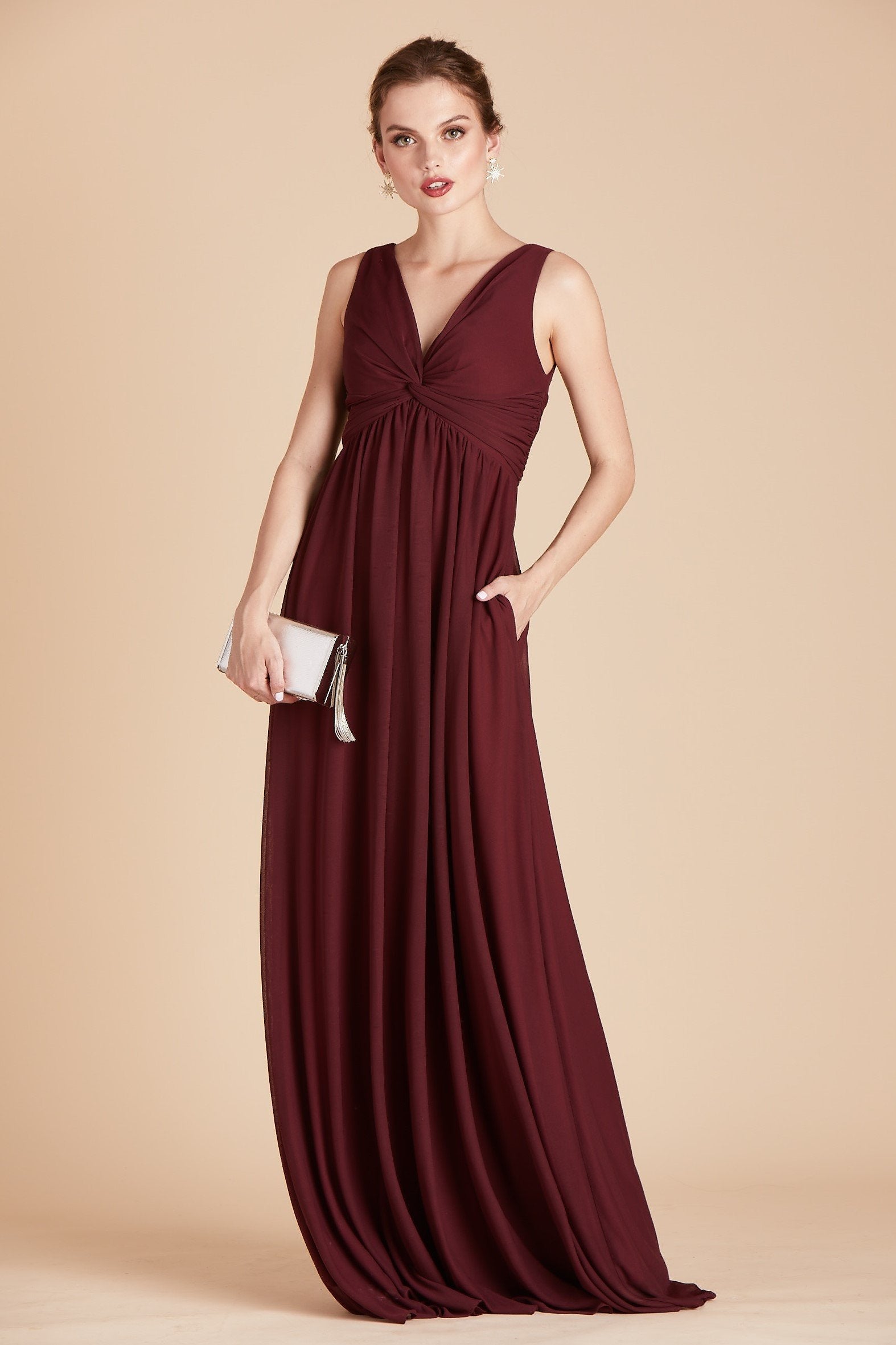 Lianna bridesmaid dress in cabernet burgundy chiffon by Birdy Grey, front view with hand in pocket