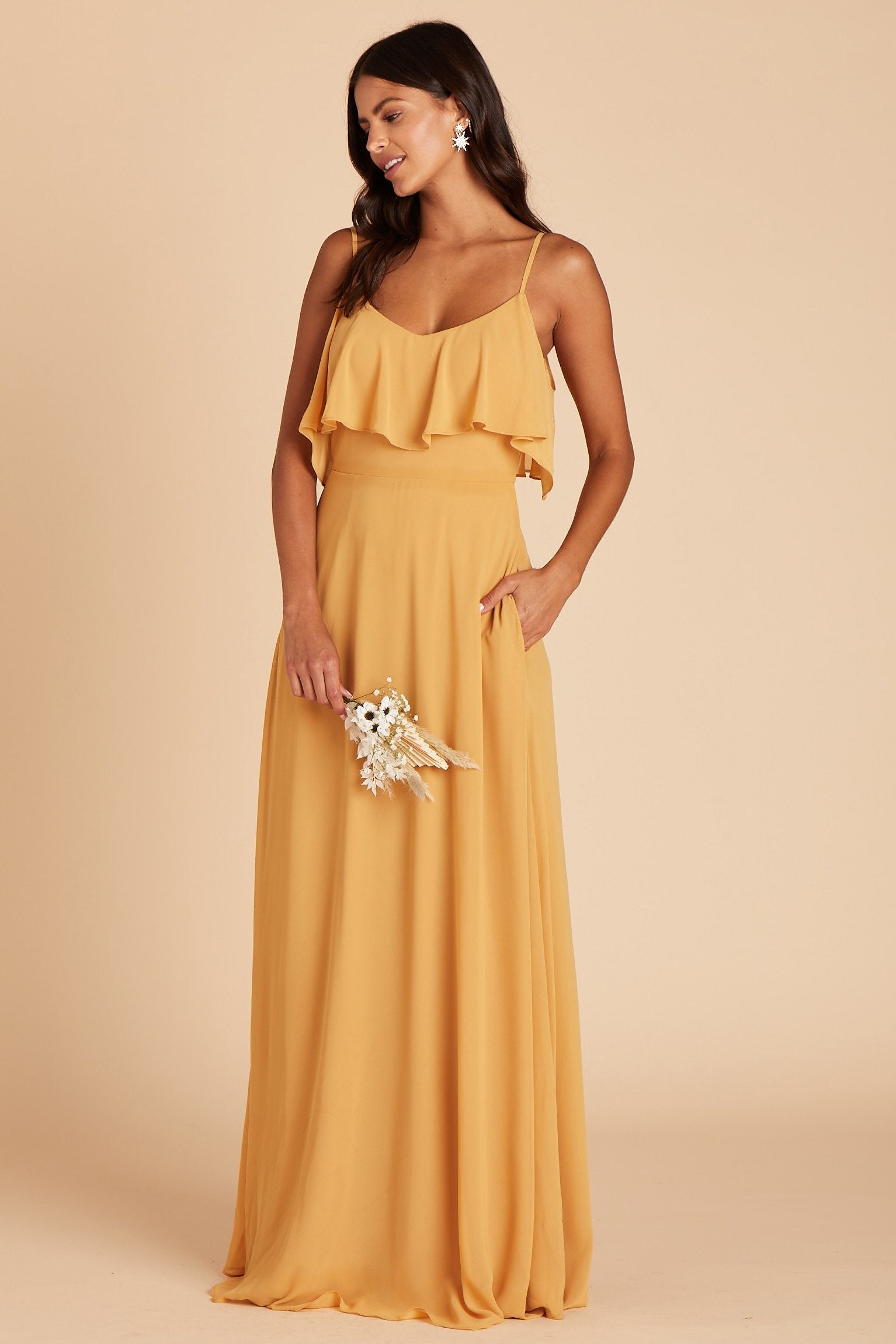 Jane convertible bridesmaid dress in marigold chiffon by Birdy Grey, front view with hand in pocket