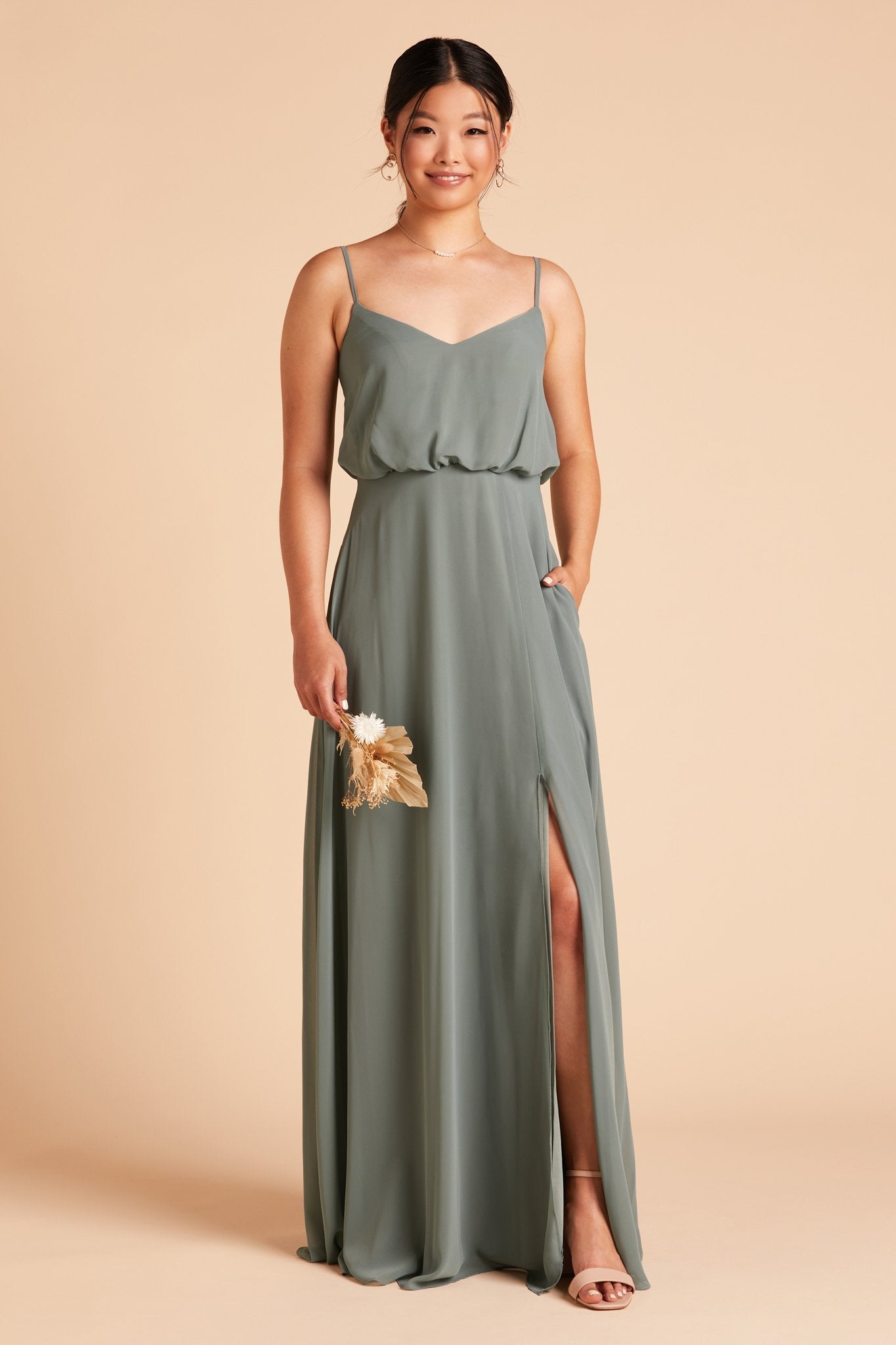 Gwennie bridesmaid dress with slit in sea glass green chiffon by Birdy Grey, front view with hand in pocket