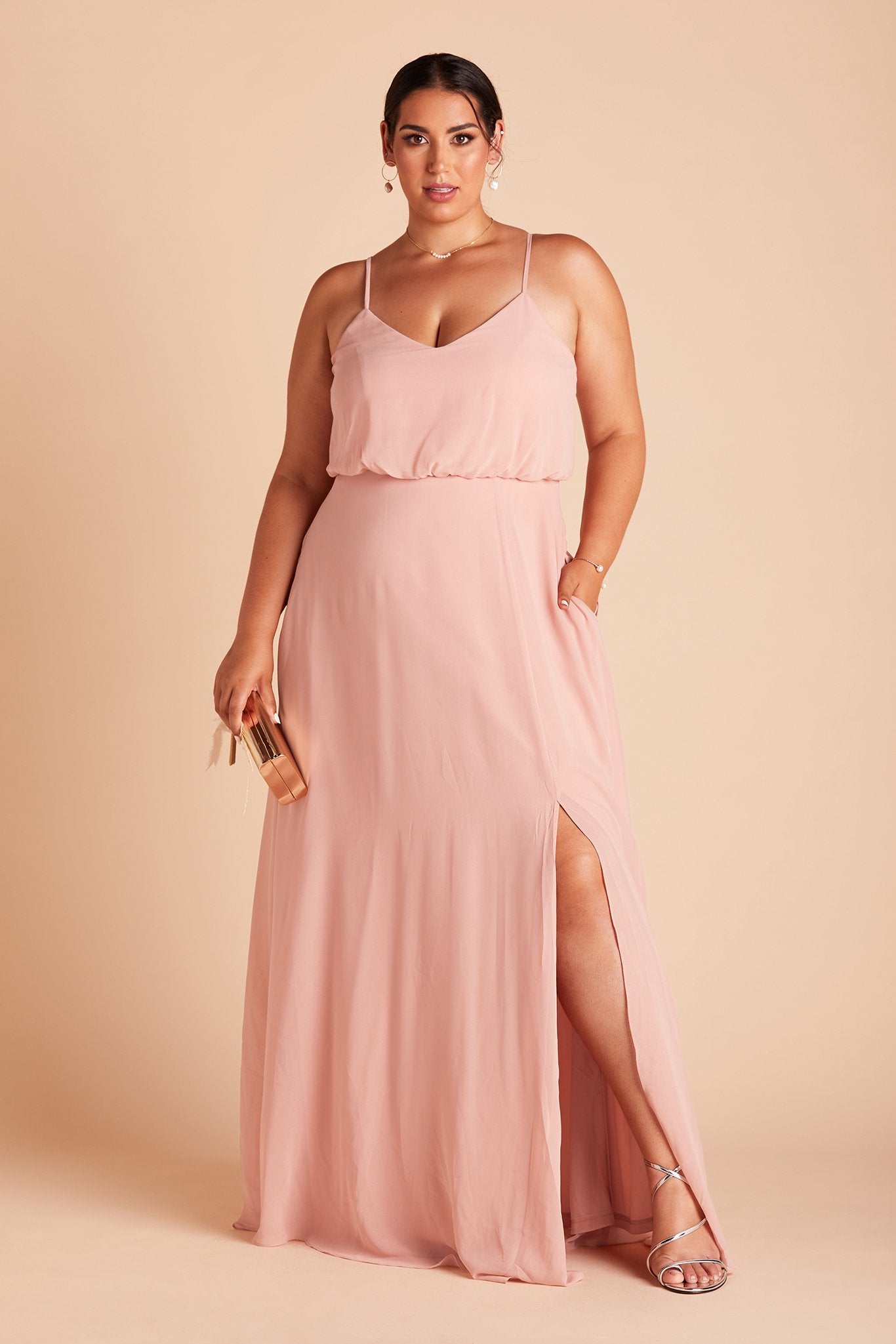 Gwennie plus size bridesmaid dress with slit in dusty rose chiffon by Birdy Grey, front view with hand in pocket