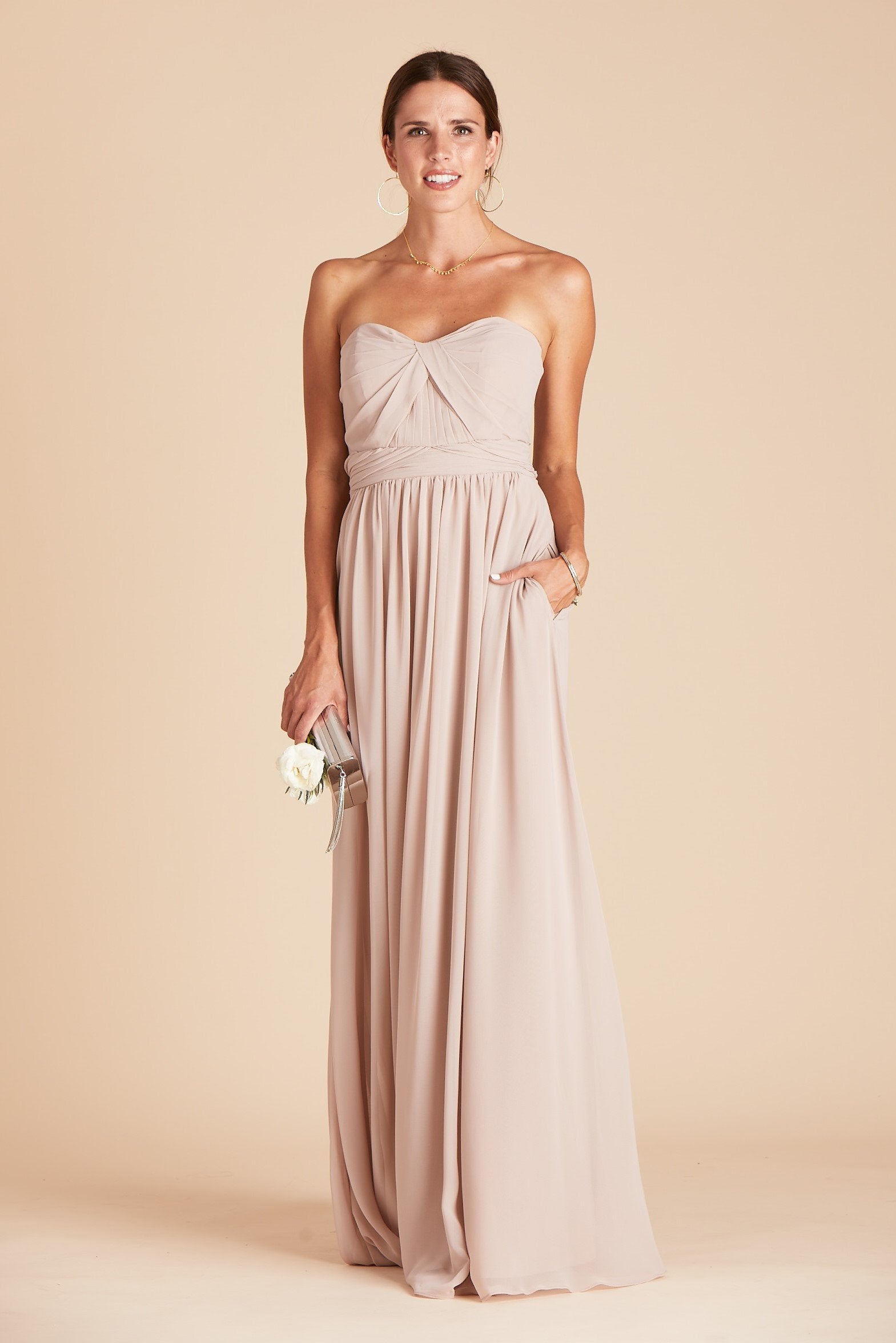 Grace convertible bridesmaid dress in taupe chiffon by Birdy Grey, front view with hand in pocket