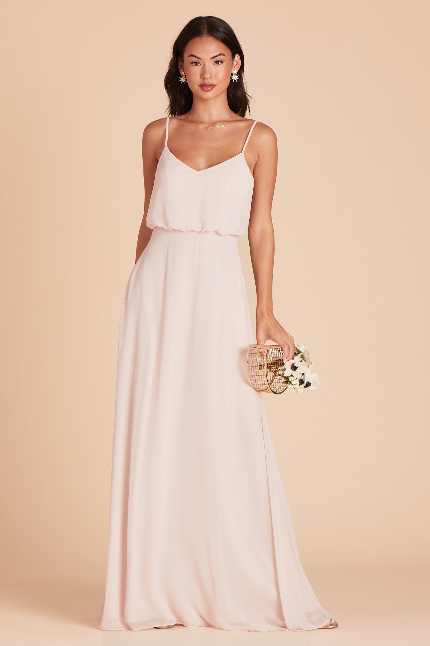 Gwennie bridesmaid dress in pale blush chiffon by Birdy Grey, front view with hand in pocket