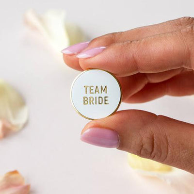 Team Bride Enamel Pin in white and gold by Birdy Grey, front view