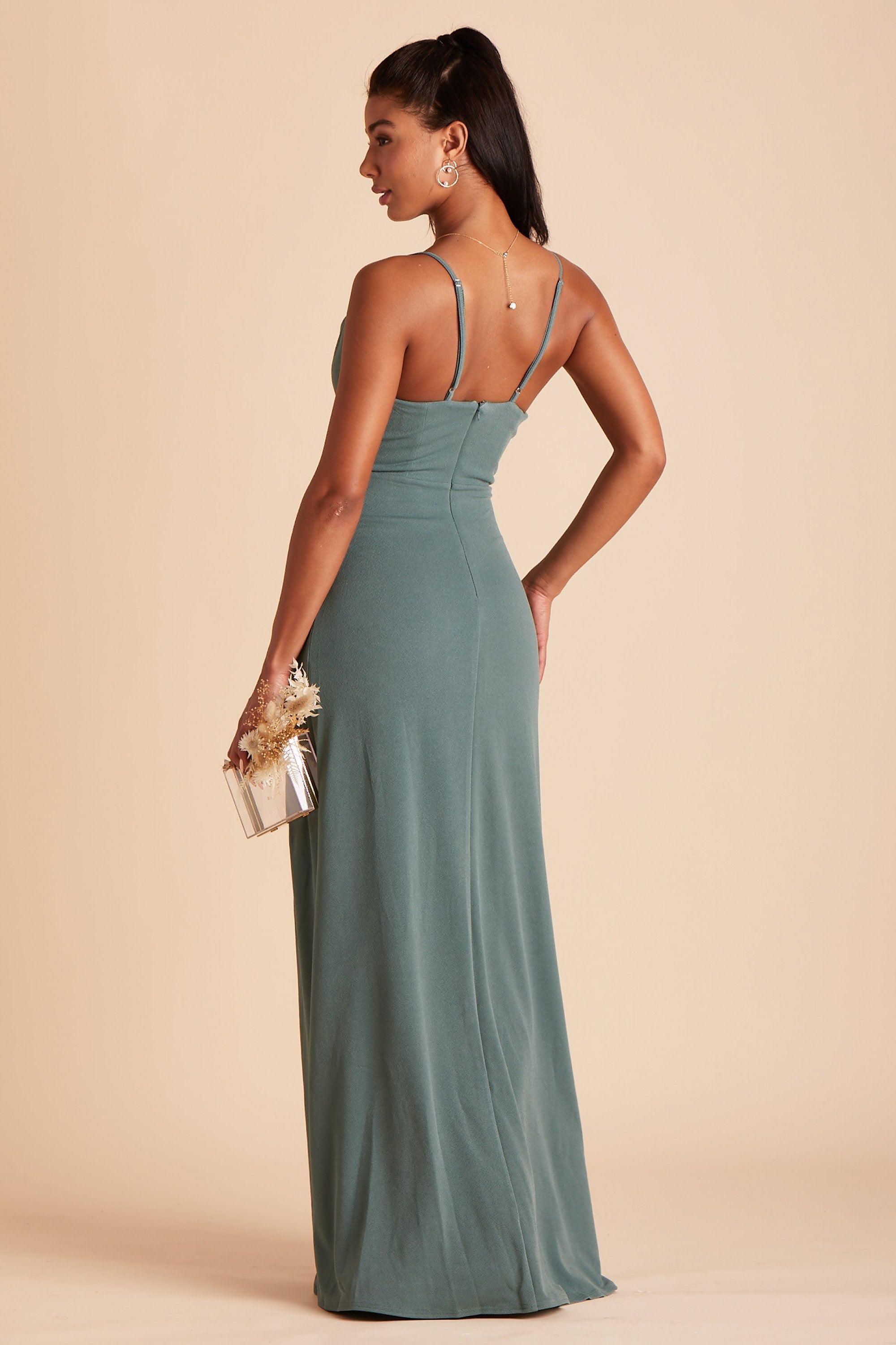 Back view of the Ash Bridesmaid Dress in sea glass crepe shows skinny adjustable straps as well as an open back just below shoulder blades.