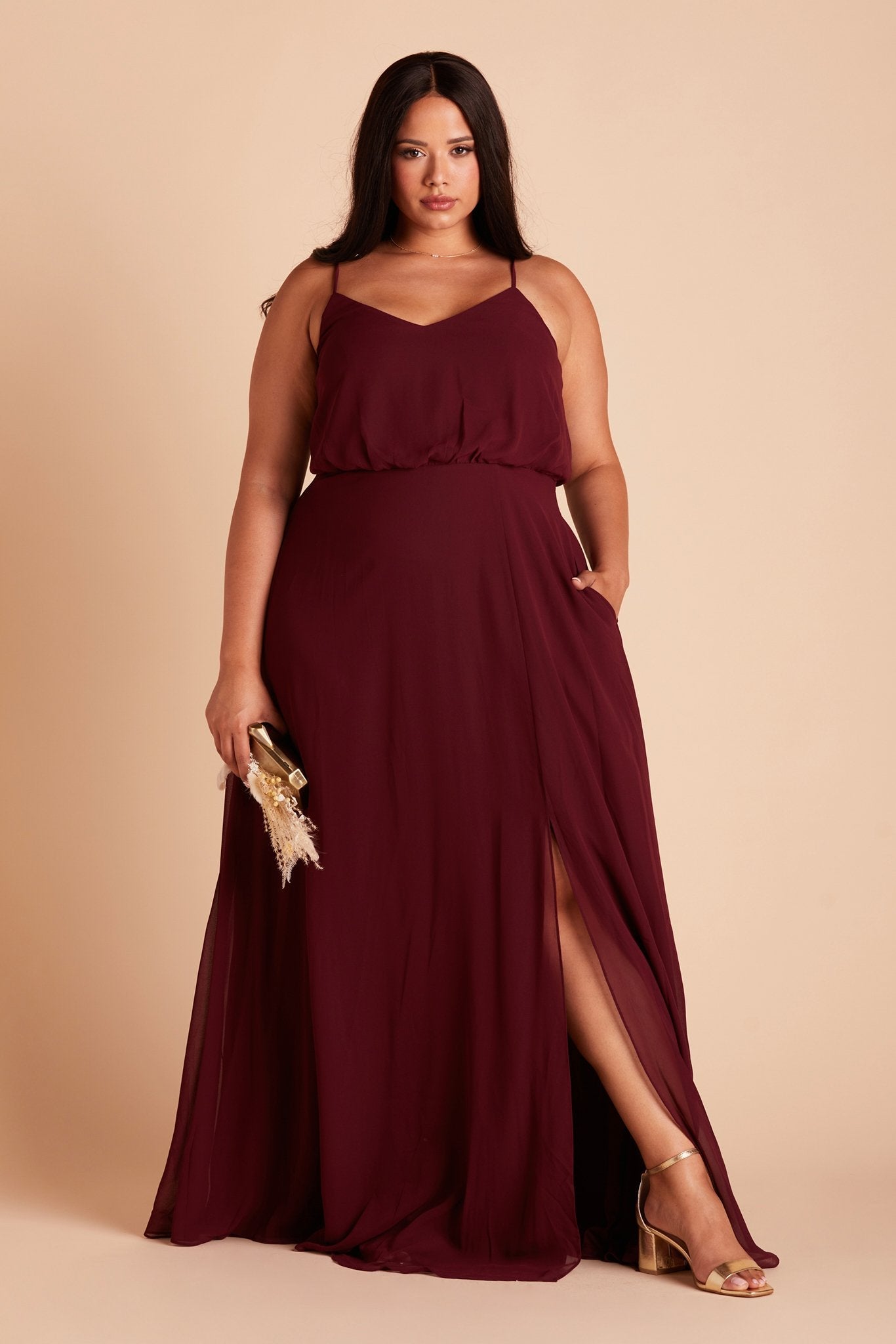 Gwennie plus size bridesmaid dress with slit in cabernet burgundy chiffon by Birdy Grey, front view with hand in pocket