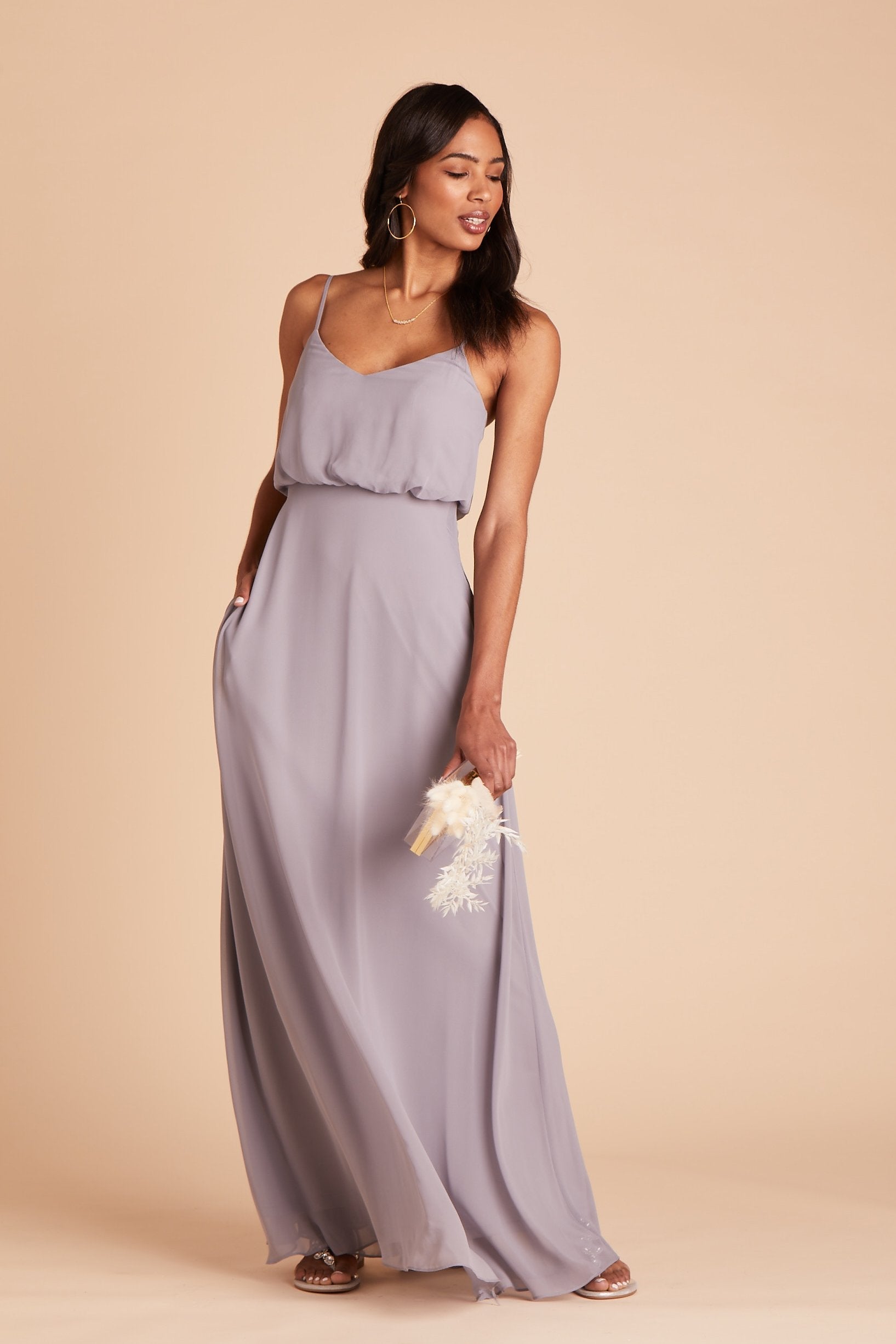 Gwennie bridesmaid dress in silver chiffon by Birdy Grey, front view with hand in pocket