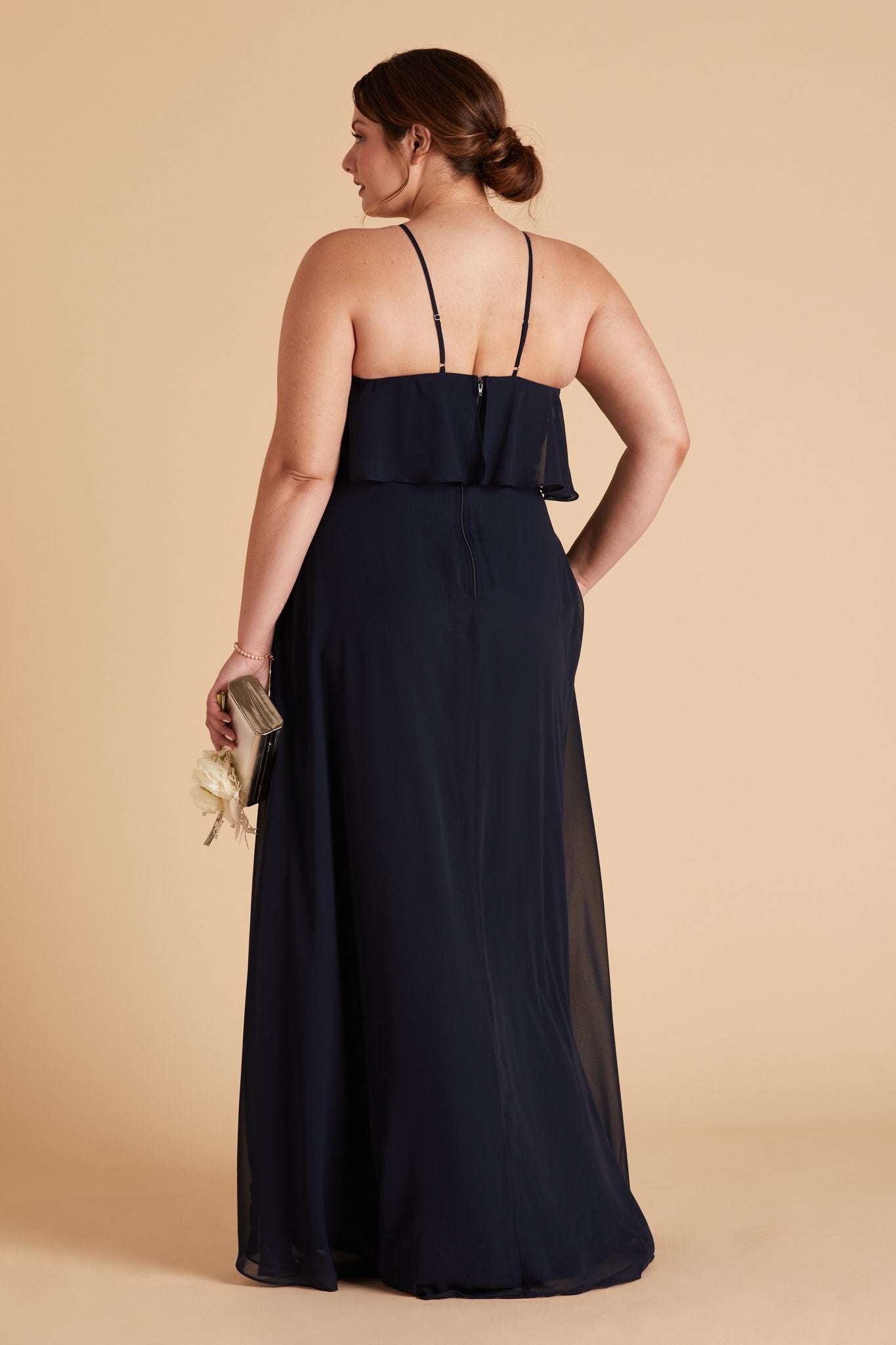 Jules plus size bridesmaid dress in navy blue chiffon by Birdy Grey, back view with hand in pocket