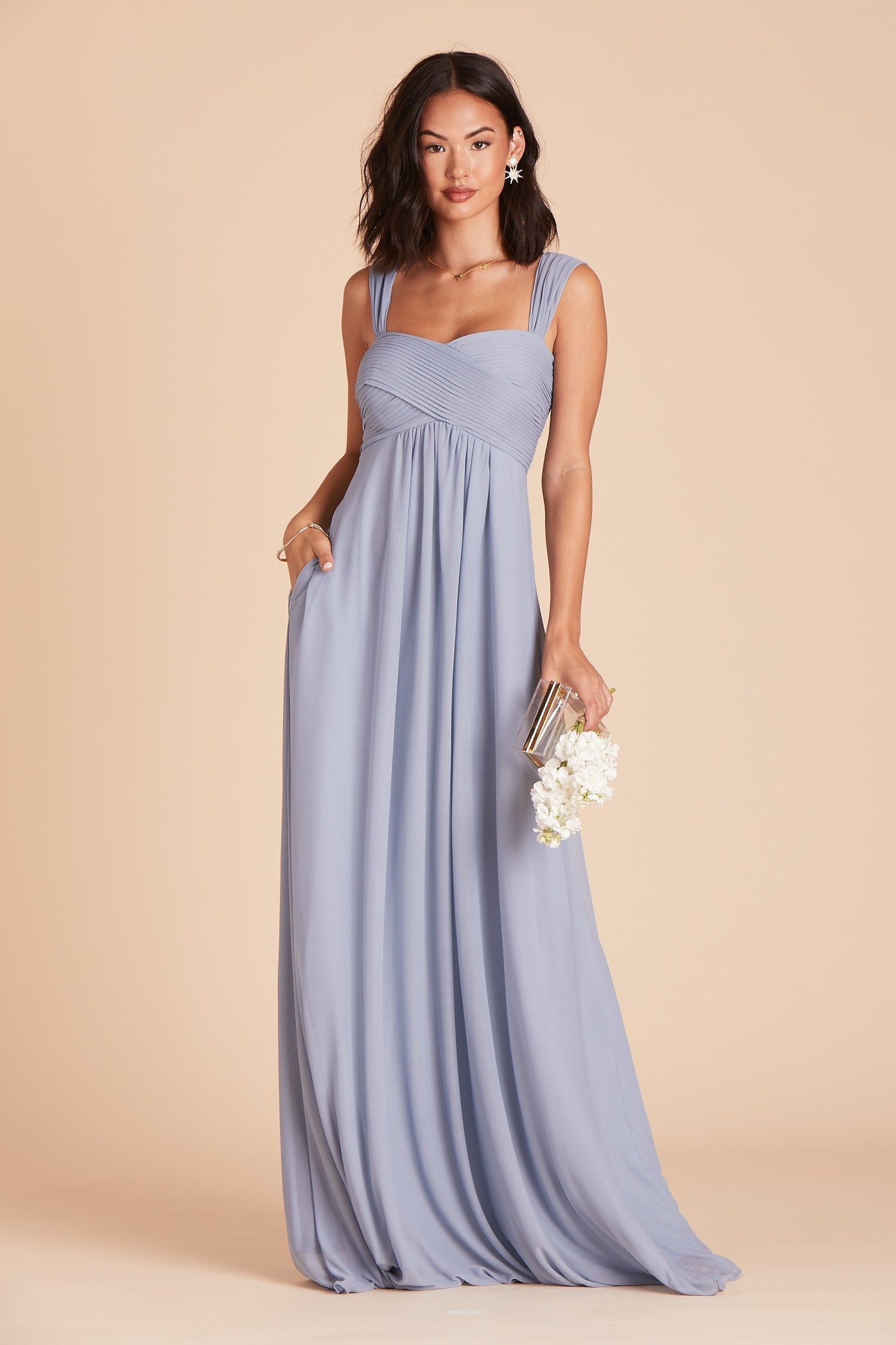 Maria convertible bridesmaids dress in dusty blue chiffon by Birdy Grey, front view with hand in pocket