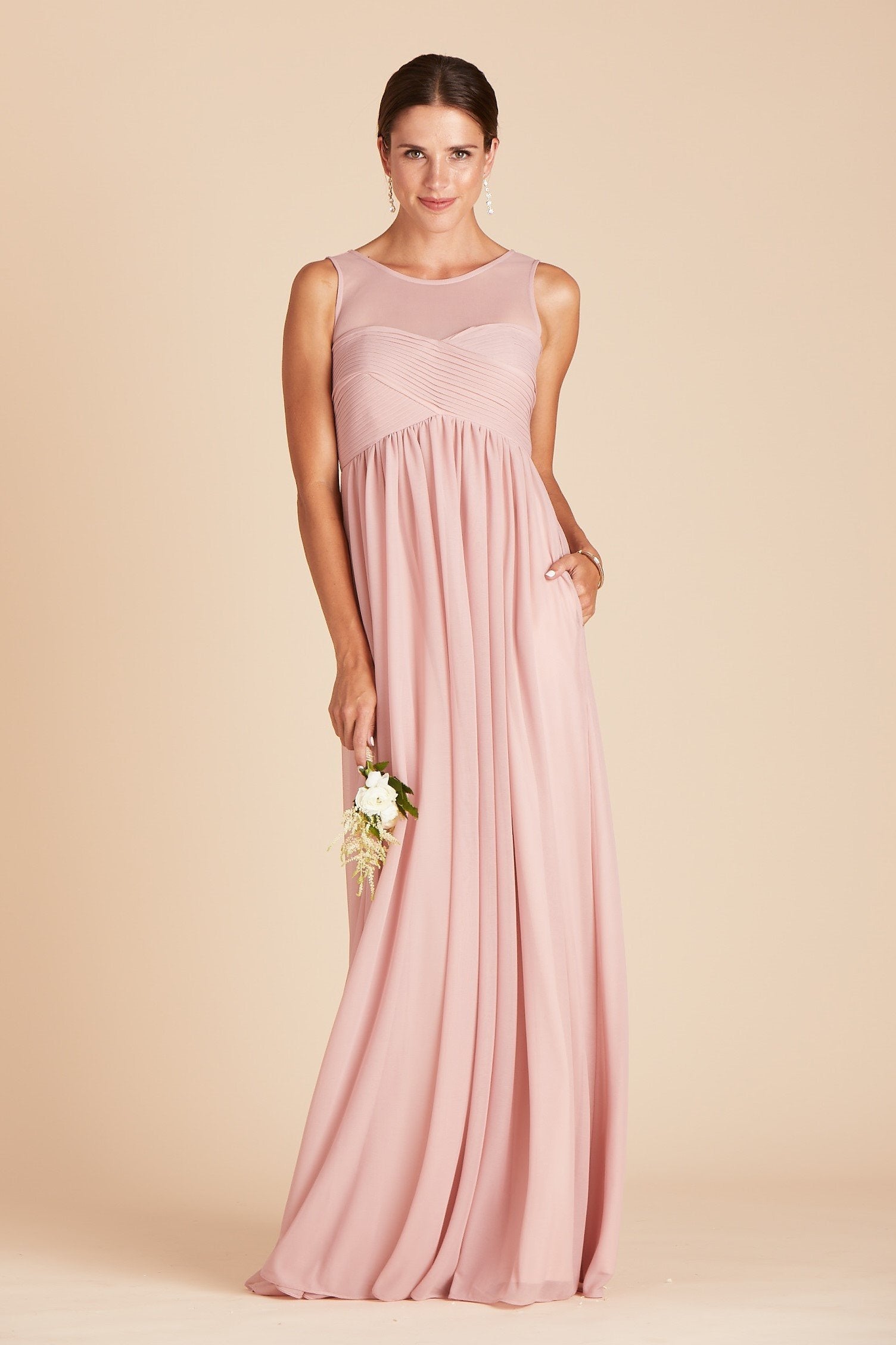 Ryan bridesmaid dress in dusty rose pink chiffon by Birdy Grey, front view with hand in pocket