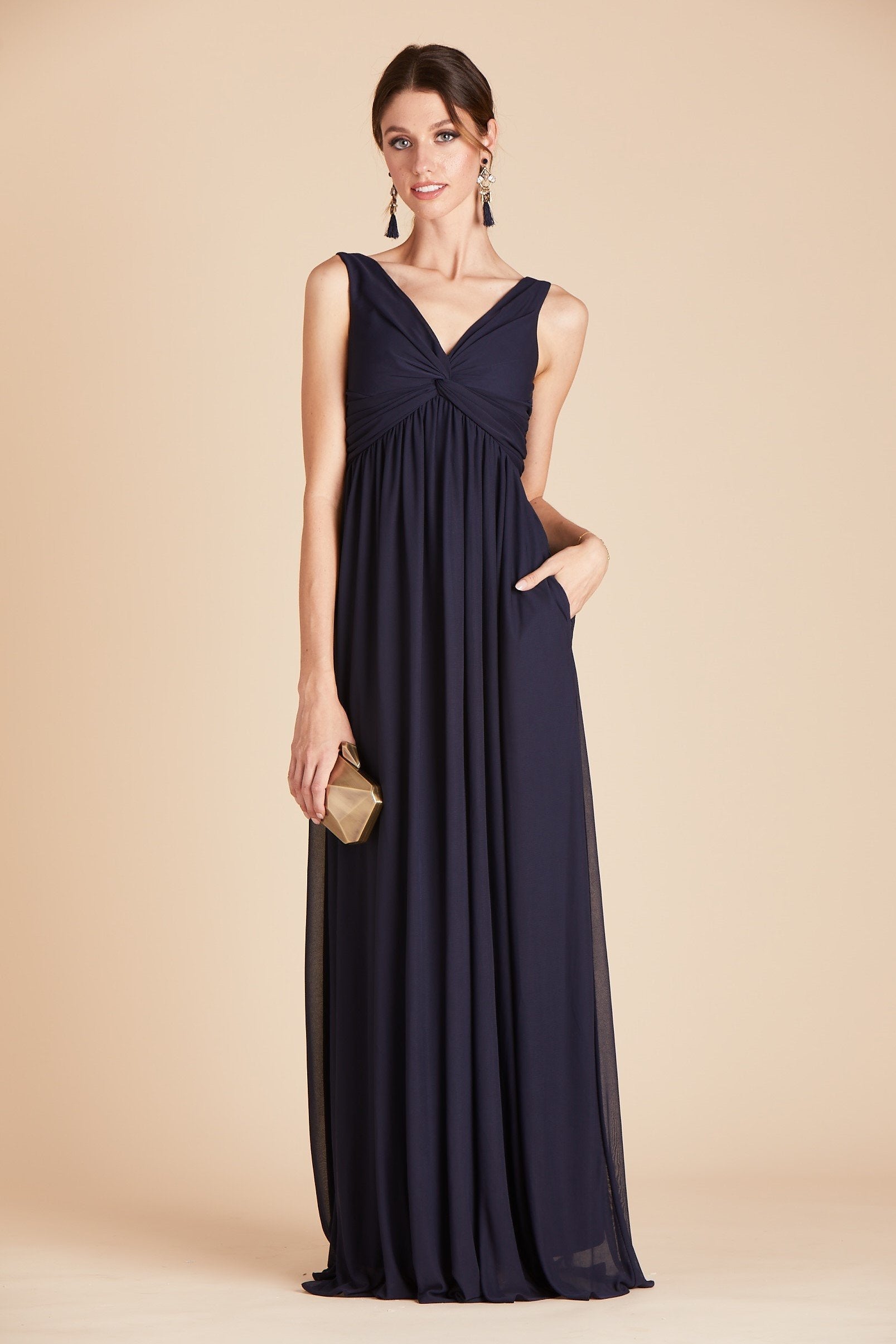 Lianna bridesmaid dress in navy blue chiffon by Birdy Grey, front view with hand in pocket