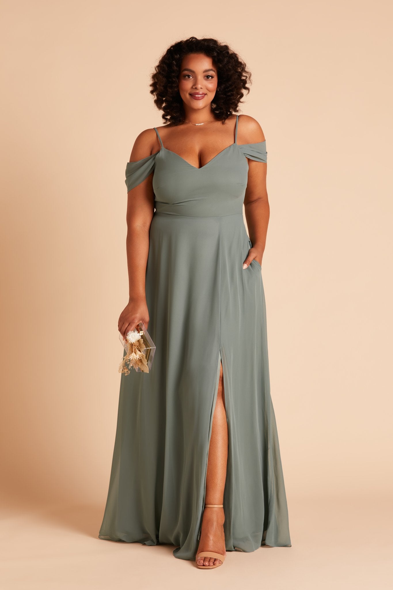 Devin convertible plus size bridesmaids dress with slit in sea glass green chiffon by Birdy Grey, front view with hand in pocket