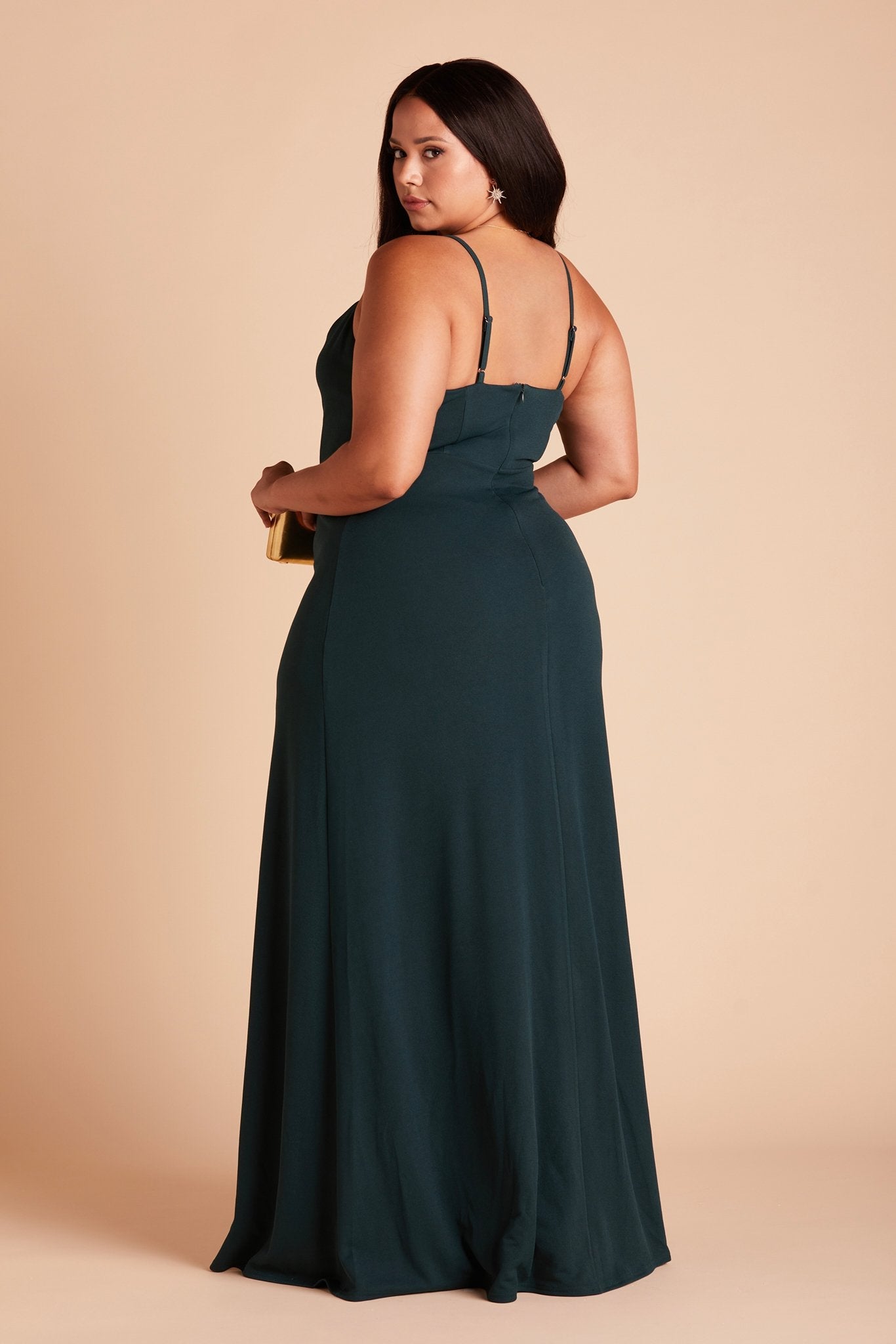 Back view of the Ash Plus Size Bridesmaid Dress in emerald crepe shows skinny adjustable straps as well as an open back just below shoulder blades.